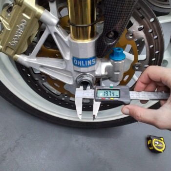Lightech black wheel axle sliders WAPAP403 for Rsv4 and Tuono V4 from 2022